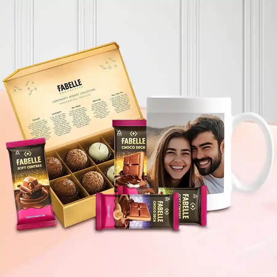 Subtle Gift Triplet featuring a custom heart-shaped cushion, coffee mug, and an assortment of Fabelle chocolates.