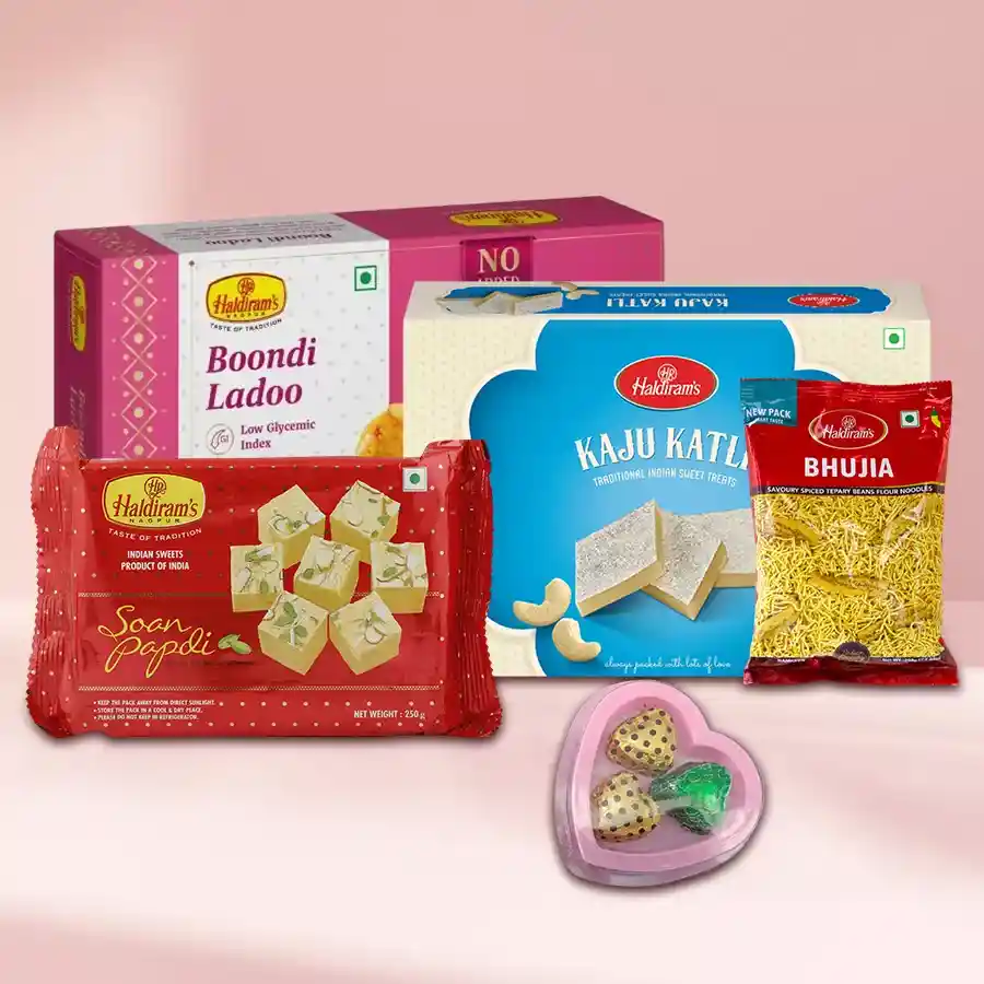Haldirams Appetizing Gift Combo heart-shaped box featuring Soan Papdi, Kaju Katli, Bhujia, Boondi Ladoo, and homemade chocolates