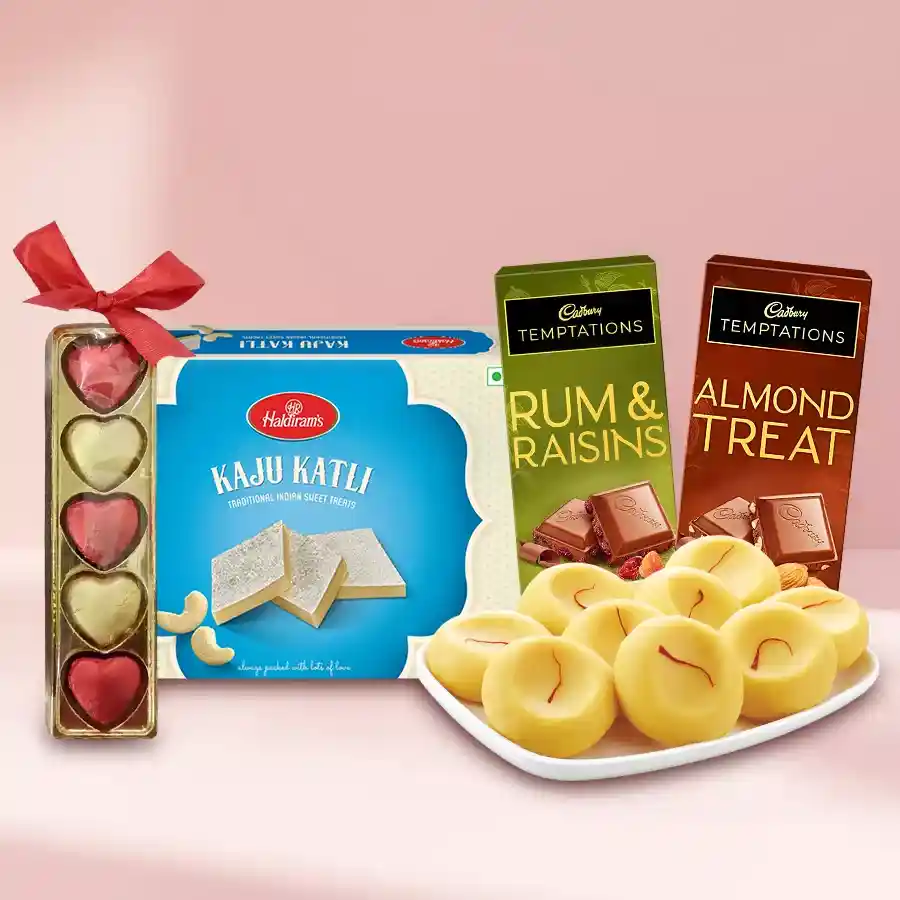 Sweets N Savory Combo featuring Haldirams Kaju Katli, Kesaria Peda, Cadbury Temptation Chocolate Bars, and homemade chocolates in a beautifully arranged hamper.