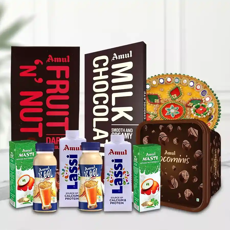 Celebration Hamper featuring Amul’s Fruit n Nut Bar, Milk Chocolate Bar, Chocomins, Lassi, Kool, Butter Milk, and a Designer Pooja Thali.