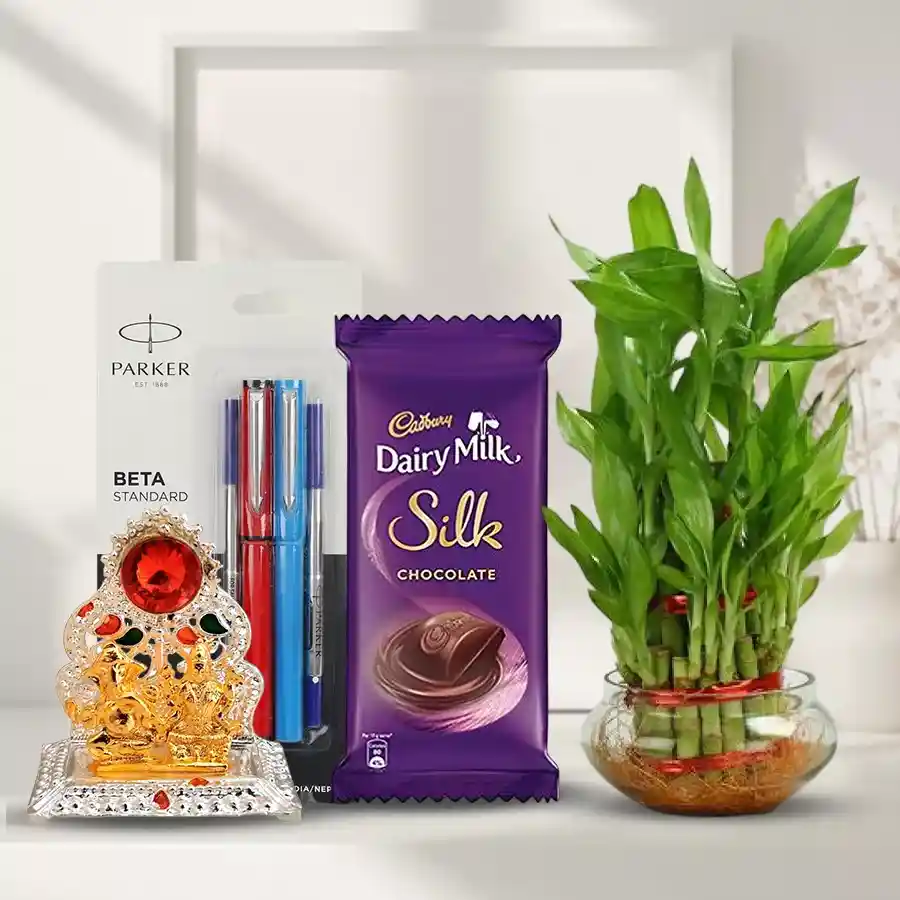 Good Luck Gifts combo featuring a 2-tier Lucky Bamboo Plant, Laxmi Ganesh Mandap, Parker Beta Pen set, and Cadbury Dairy Milk Silk bar arranged beautifully