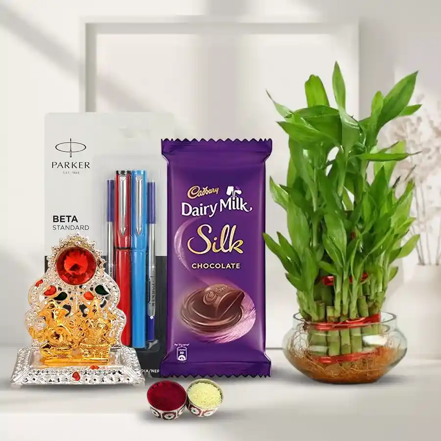 Amusing "Go Green" Combo Gift for Bhai Dooj featuring a 2-tier Lucky Bamboo Plant, antique Laxmi Ganesh Mandap, Parker Beta pen set, and Cadbury Dairy Milk Silk with roli, tika, and chawal.