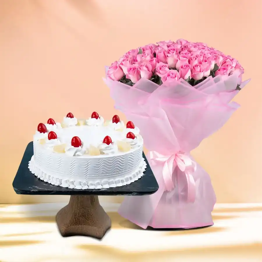 Delightful pineapple cake from 5 Star Bakery with a bouquet of 12 roses, perfect for gifting and celebrating special moments.