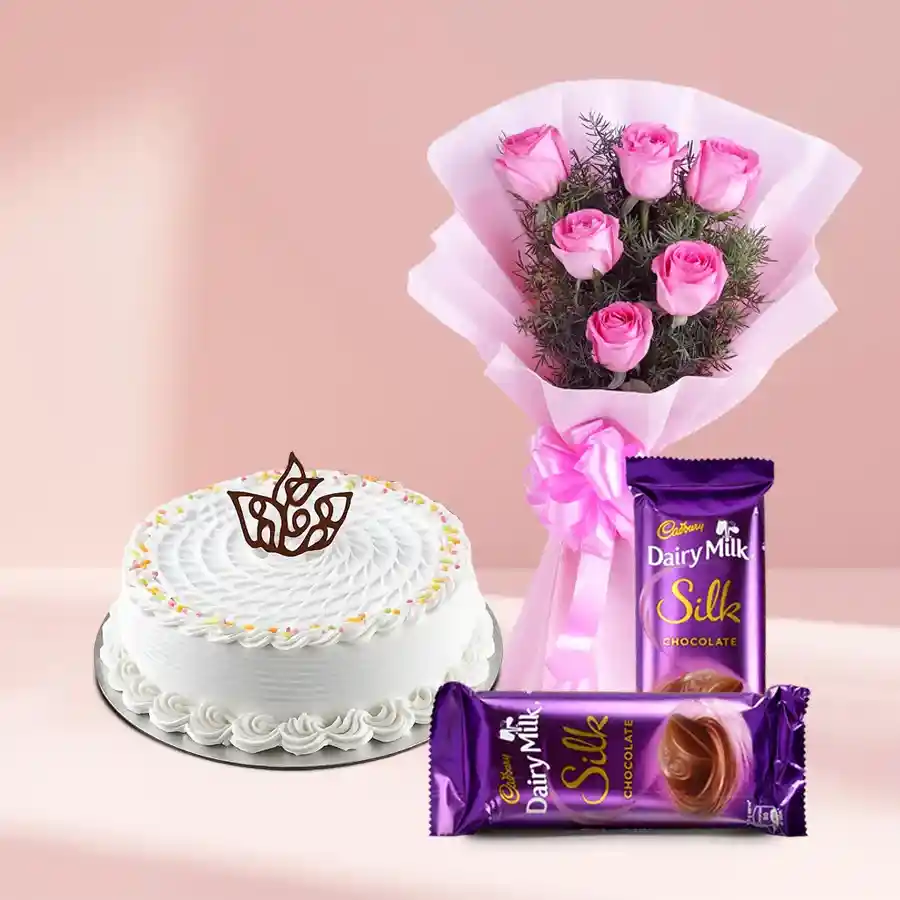 1 kg Vanilla Cake with 10 Pink Roses and Cadbury Chocolates gift set.