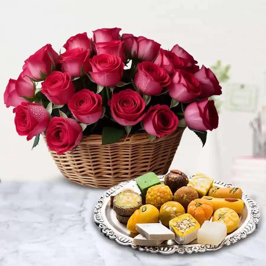 A beautiful basket featuring 18 red roses and 1/2 Kg assorted sweets for Mother's Day.