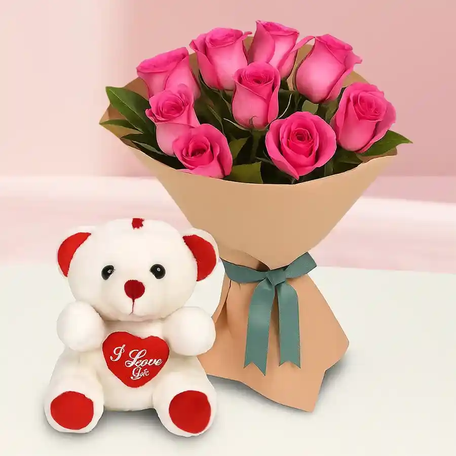 A small teddy bear with a bouquet of 12 pink roses, perfect for Mother's Day gifting.