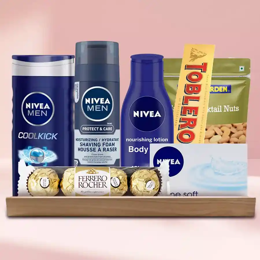 Remarkable Nivea Grooming Set displayed on a stylish wooden tray, featuring Nivea Cool Kick Shower Gel, Moisturising Shaving Foam, Body Lotion, classic Nivea Soap, Ferrero Rocher, Toblerone Swiss Chocolate, and Tong Garden Mix Nuts.