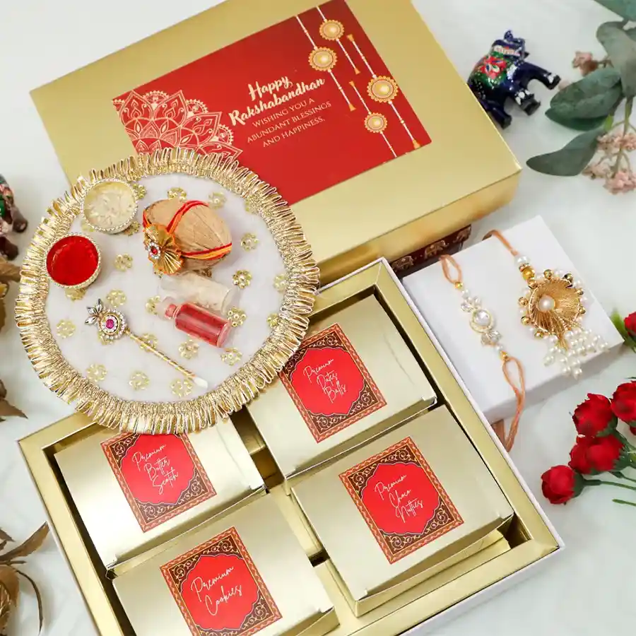 Radiant Raksha Bandhan Gift Set featuring a Blue Stone Brother Rakhi, assorted chocolates, pooja thali, and essential festive items.