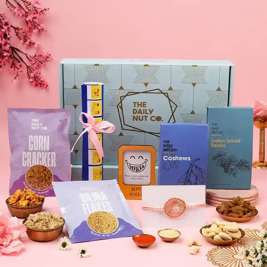 Cherished Moments Rakhi Snack Gift with various snacks and a personalized photo.