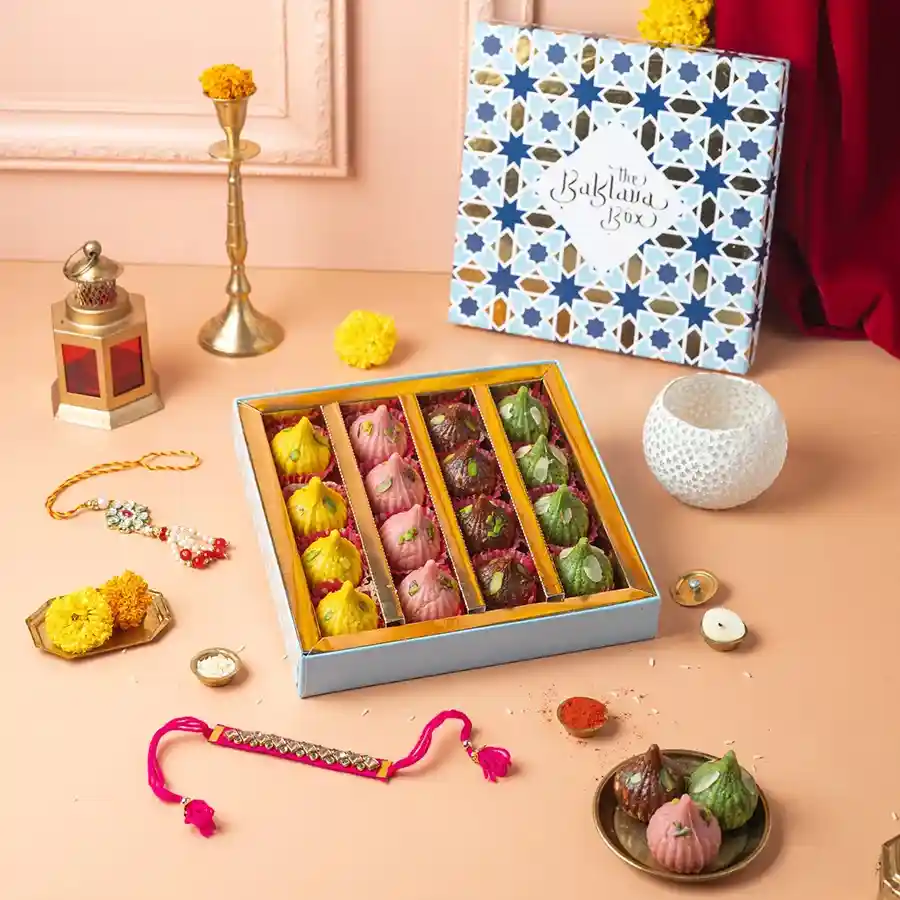 Festive Rakhi & Modak Celebration Bundle featuring assorted sweets and rakhis.