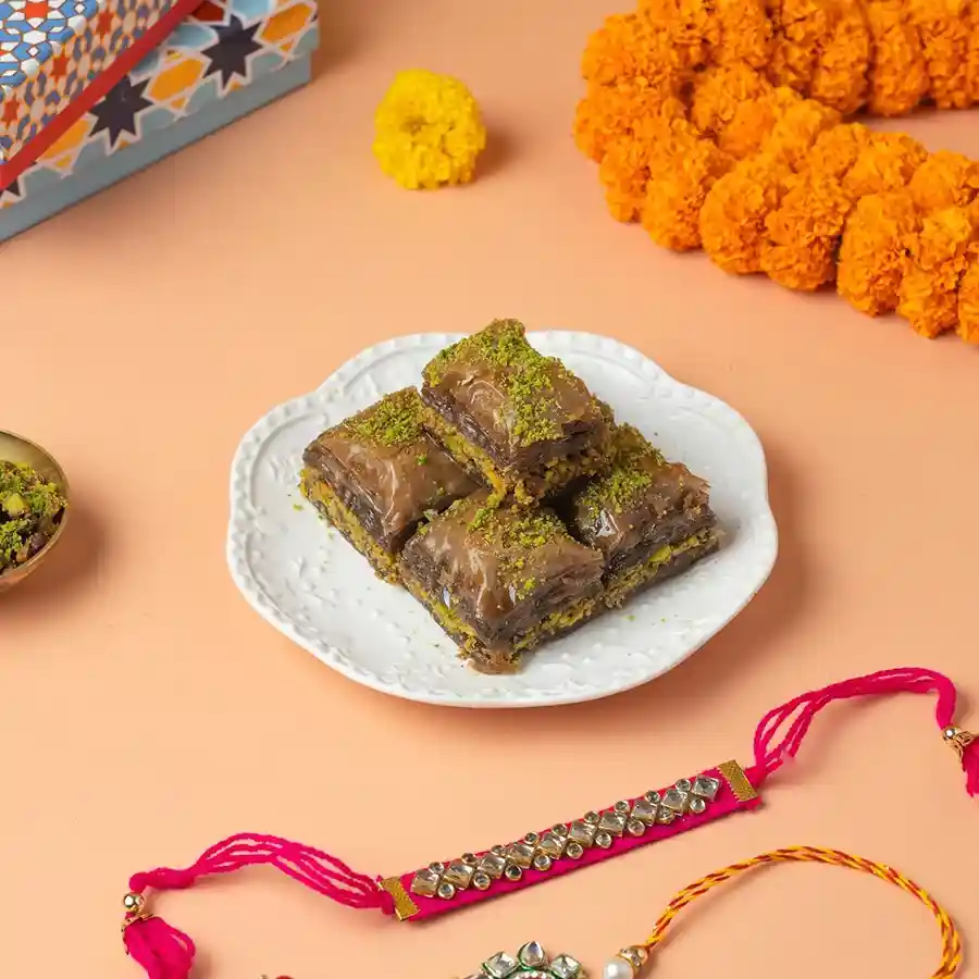 Chocolate Baklava N Rakhi Duo featuring baklava and decorative Rakhi sets.