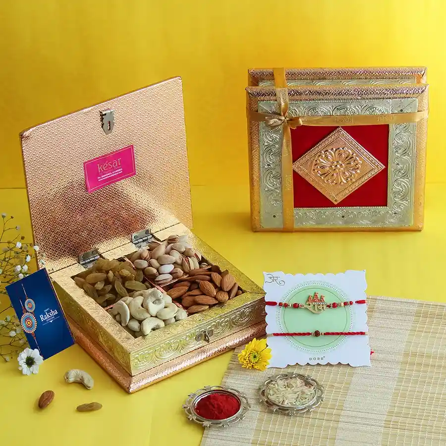 Exquisite Rakhi & Nuts Medley featuring Ram Rudra Rakhis and assorted dry fruits in a charming gift box.