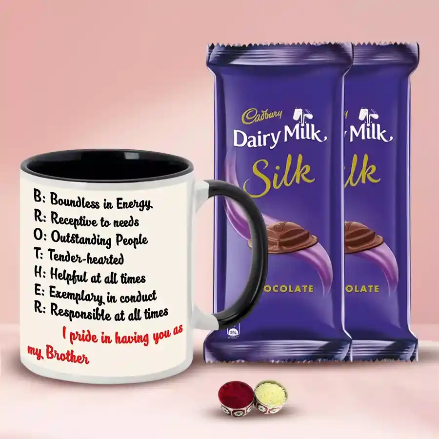 Coffee mug with Cadbury Silk bars, Tika, and Chawal for Bhai Dooj celebration.