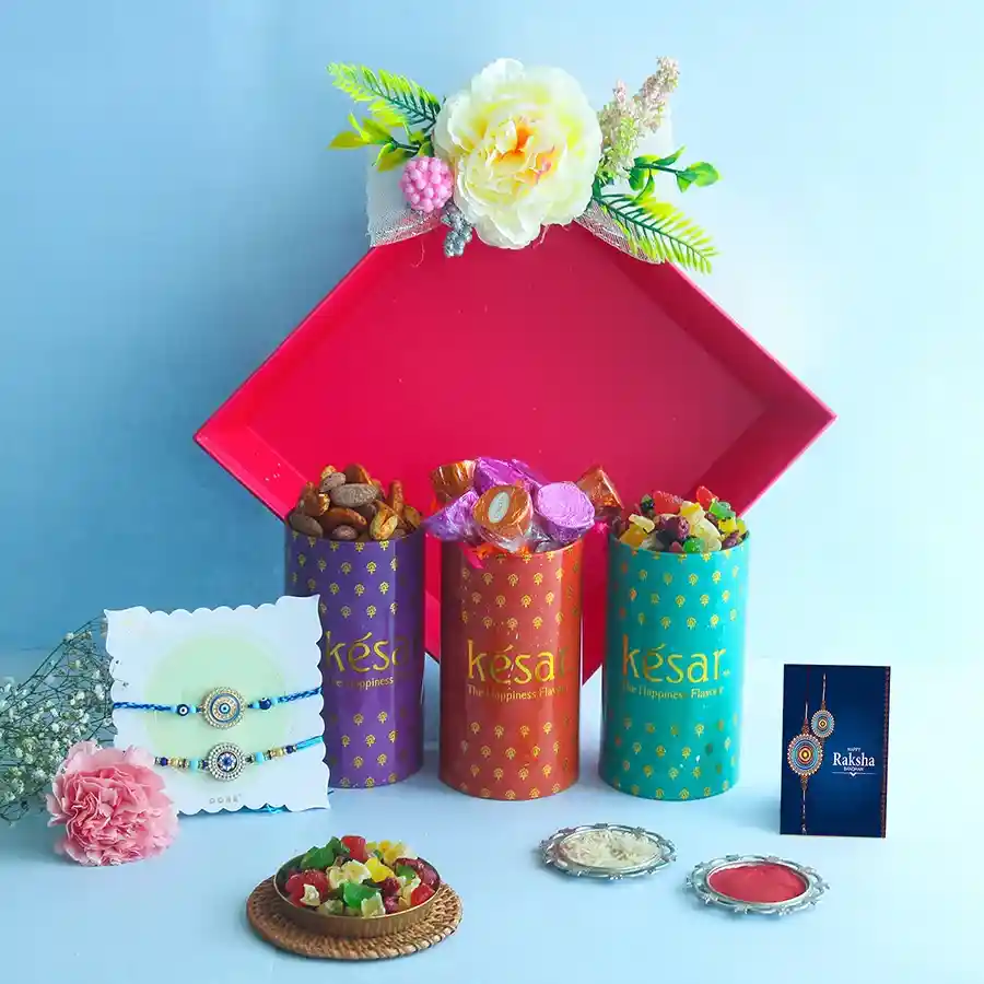 Radiant Rakhi Treasures Box with Blue Pearl Rakhis and treats.