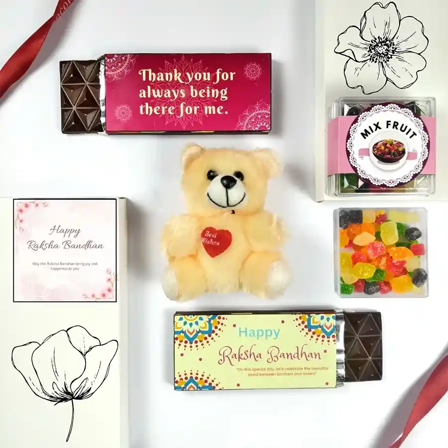 Sweet Surprises for Sibling Love gift pack featuring chocolate, fruit, a teddy bear, and a greeting card for Raksha Bandhan.