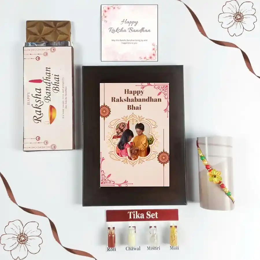 Raksha Bandhan Keepsake Collection with chocolate, personalized frame, Rakhi, Tika set, and greeting card.