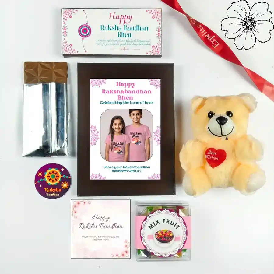 Joyful Rakhi Celebration Gift Set featuring chocolates, teddy bear, customized photo frame, and mixed fruits.