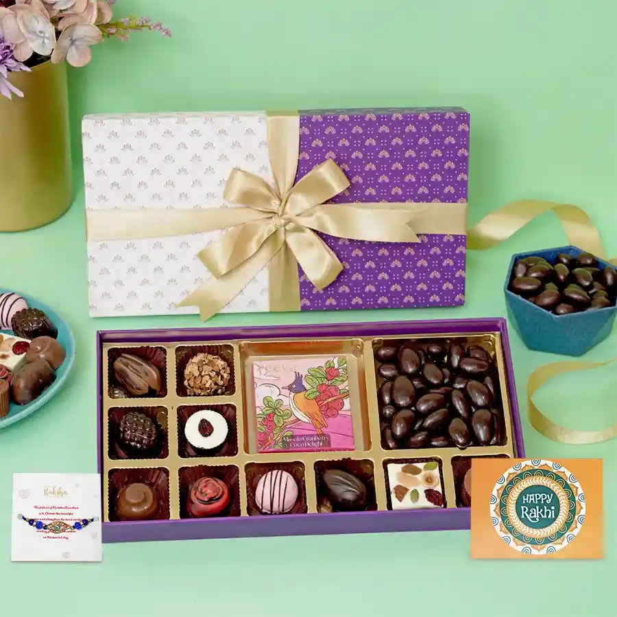 Sweet Protection Rakhi Gift Basket with Evil Eye Rakhi, assorted chocolates, and a greetings card.