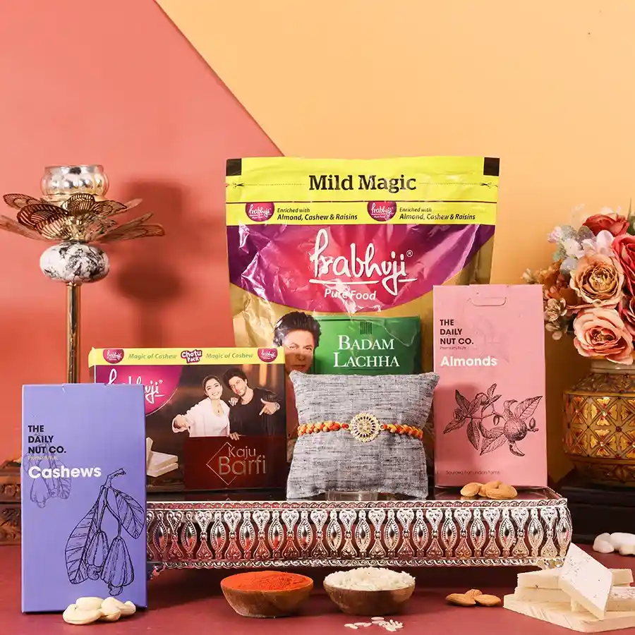 Rakhi Joy with Festive Goodies Combo featuring rakhi, cashews, almonds, and sweets for Raksha Bandhan.