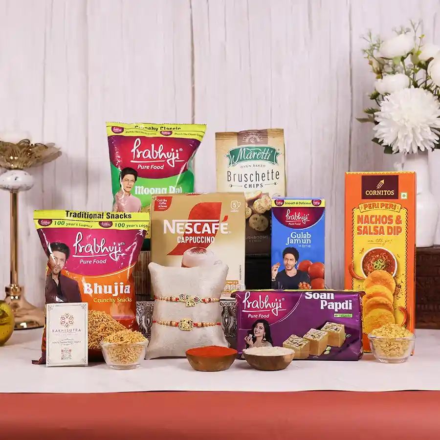 Festive Rakhi Snack Surprise Box featuring designer Rakhi, snacks, and a reusable gift box for sibling celebrations.