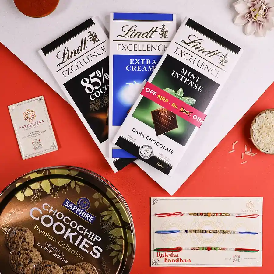 Sibling Love Rakhi Delight Set featuring rakhi, chocolates, cookies, and a message card in a reusable gift box for Raksha Bandhan.