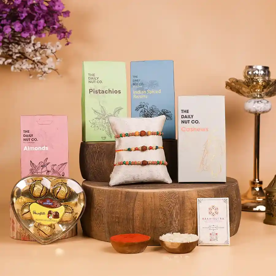 Rakhi & Dry Fruit Gift Set with Rudraksha Rakhis and assorted nuts.
