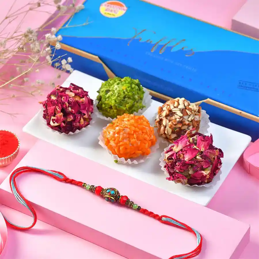 A beautiful Sweets with Crystal Rakhi Combo featuring a crystal bead Rakhi, five truffles, and a Roli Chawal card, celebrating sibling love and tradition.