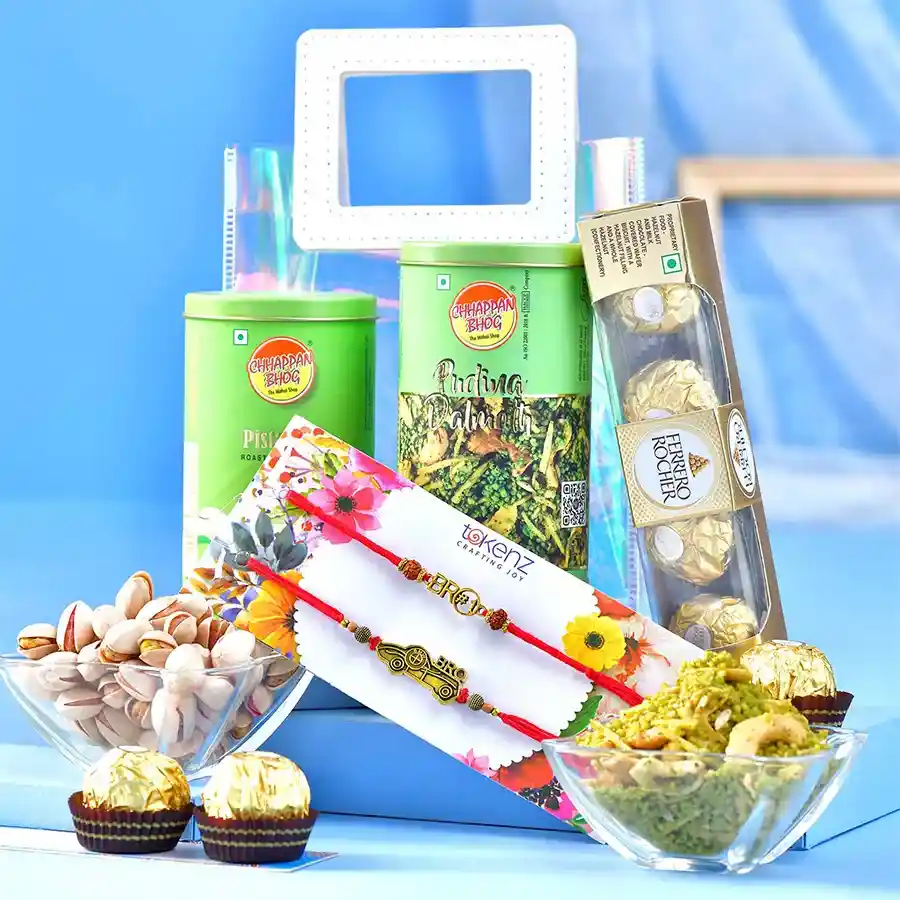 Rakhi Joy Gift Ensemble featuring antique rakhis, savory snacks, Ferrero Rocher chocolates, and a transparent gift bag ready for Raksha Bandhan celebration.