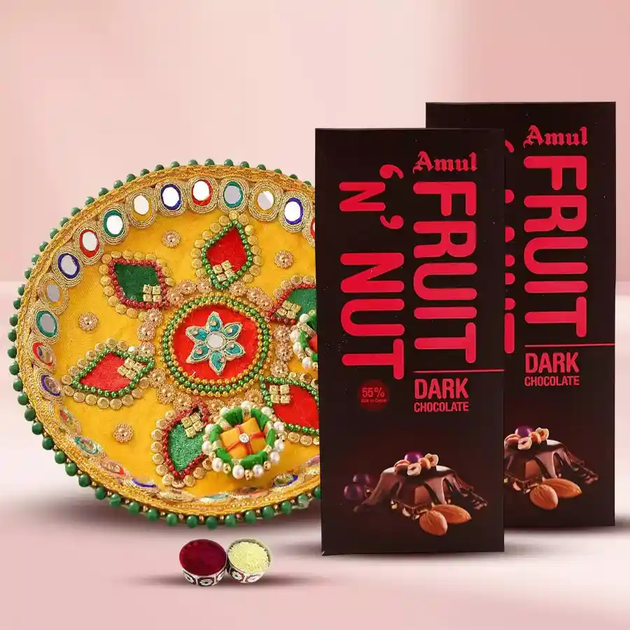 2 pcs Amul Fruit and Nut Chocolate Bars with a decorative Pooja Thali, Tika, and Chawal for Bhai Dooj celebration.