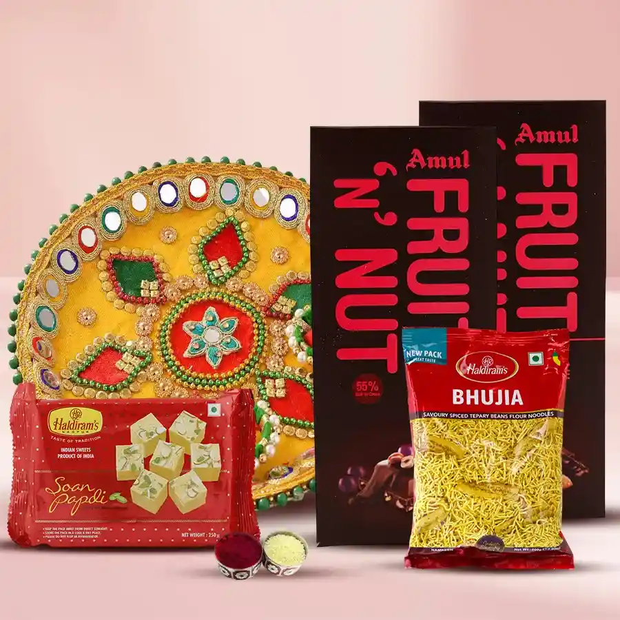 Assortment combo gift for Bhai Dooj featuring Amul Fruit n Nut Bars, Designer Pooja Thali, Haldirams Soan Papdi, Bhujia, and traditional Roli, Tika, and Chawal