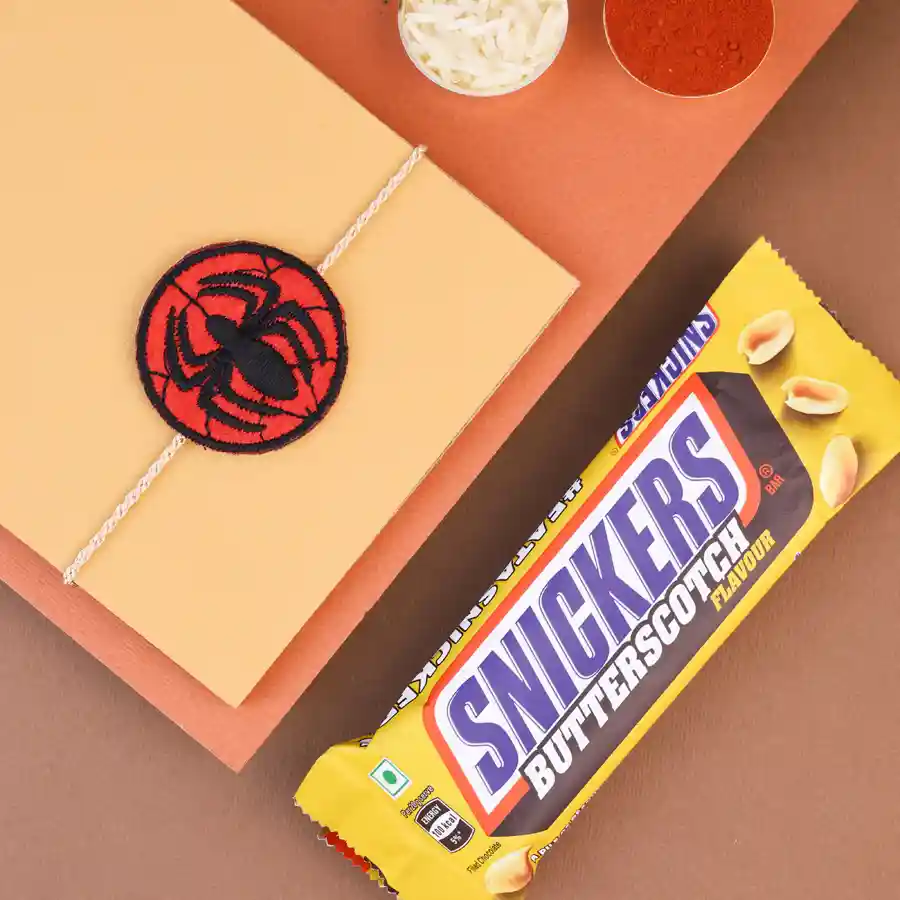 Heroic Rakhi with a Snickers Bar and traditional items