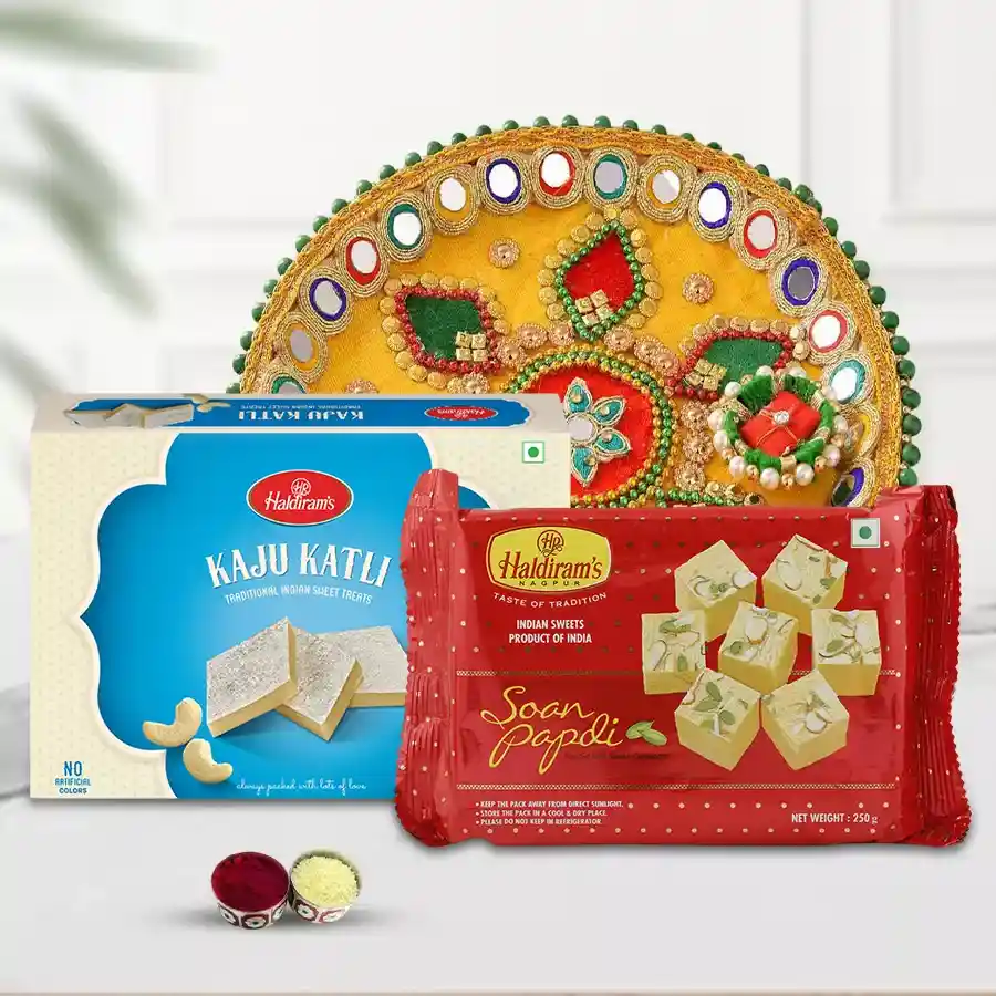 Haldirams Sweets Combo featuring Kaju Katli, Soan Papdi, and a decorative Pooja Thali with Bhai Dooj Tika and Chawal.