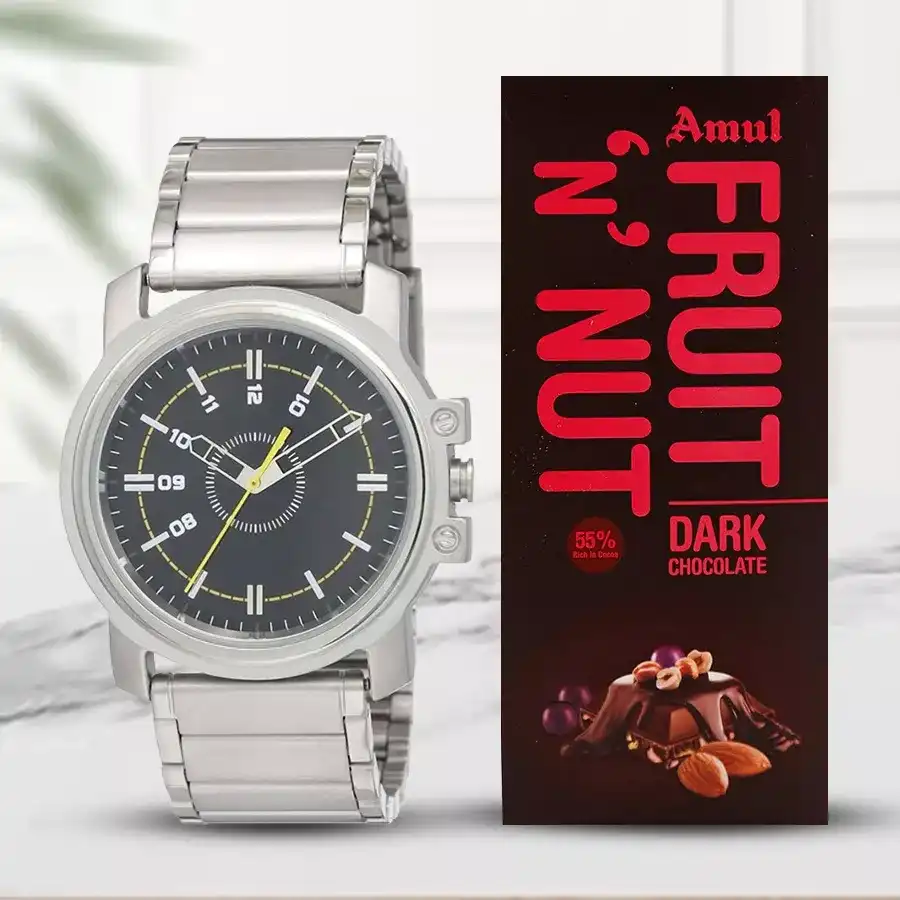 Men's watch with black dial and silver strap alongside a 100g Amul Fruit n Nut chocolate bar