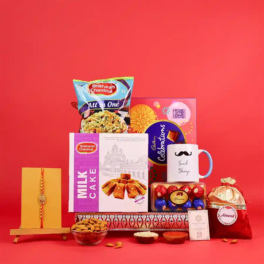 Festive Rakhi box with a Swastik rakhi and treats