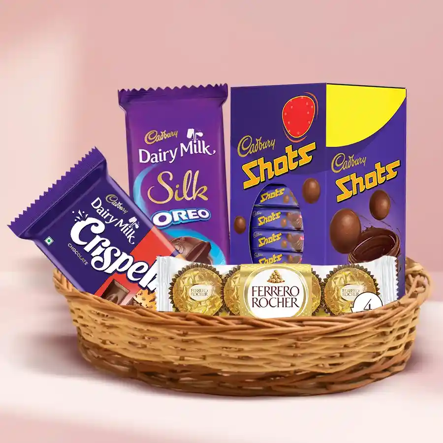 Scrumptious Chocolate Assortment Basket featuring Ferrero Rocher, Cadbury Dairy Milk Shots, Dairy Milk Silk Oreo, and Crispy Dairy Milk Crispello