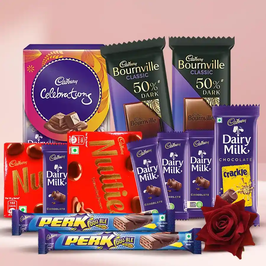 Cadbury chocolate gift hamper featuring assorted chocolates and a red velvet rose