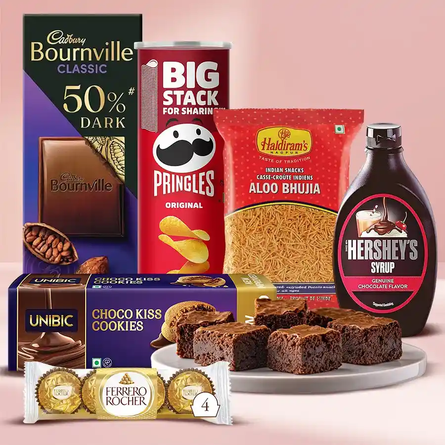 Special Holiday Delight Gift Hamper featuring Choco Kiss Cookies, Pringle Chips, Ferrero Rocher, Dry Brownies, Hershey’s Chocolate Syrup, Cadbury Temptation Rum & Raisin, and Haldiram’s Aloo Bhujia