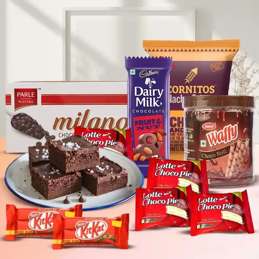 Marvelous Chocolate Treat Hamper featuring brownies, Chocopies, Milano Cookies, rolled wafers, nachos, a Cadbury bar, and KitKats arranged in an elegant presentation.