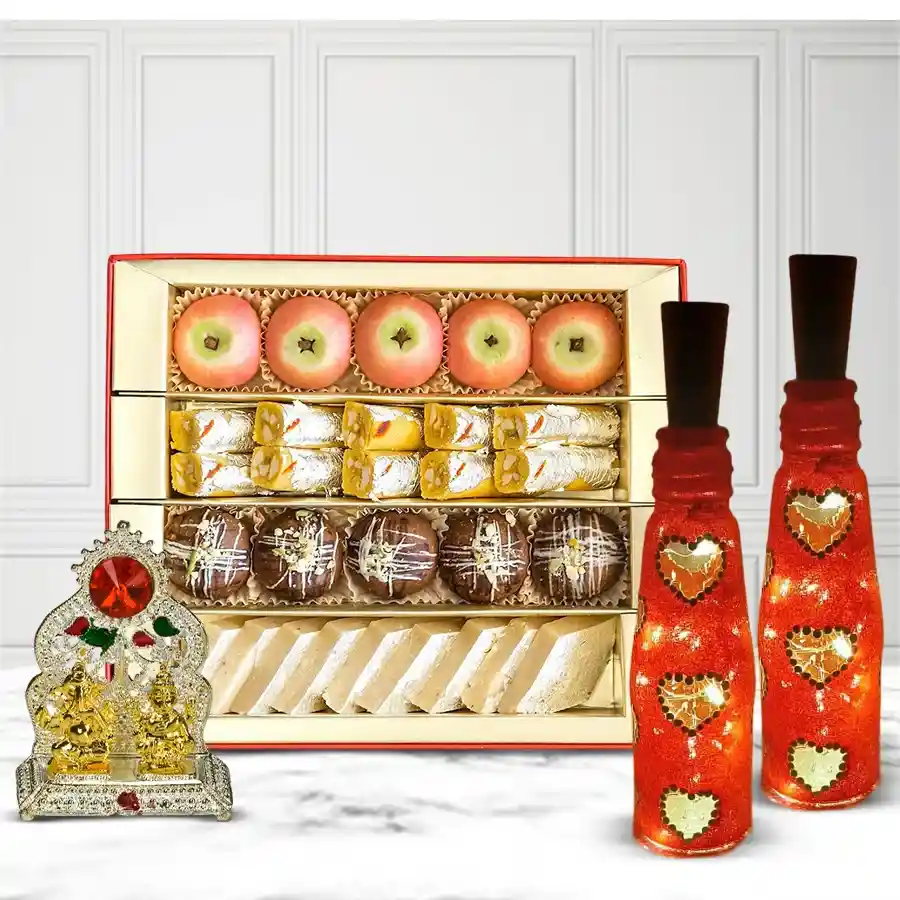 Decorative bottle art lamp set featuring antique Ganesh Laxmi mandap and assorted sweets in an elegant gift box.