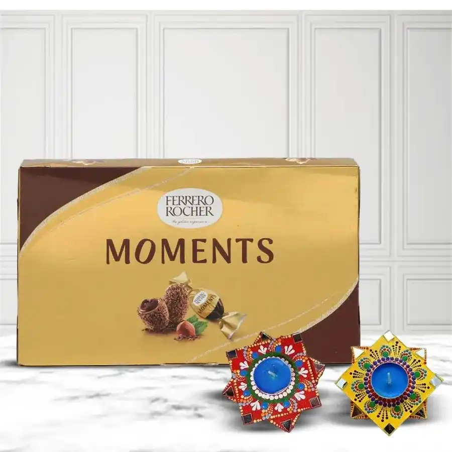 Delicious Ferrero Rocher chocolates arranged with a beautiful Twin Dot Mandala Art Diya in vibrant colors.