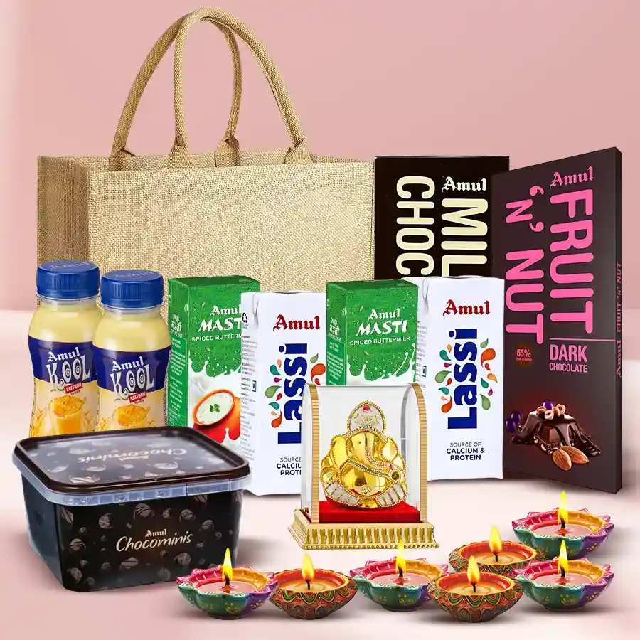 Exclusive Diwali hamper featuring Amul chocolates, fruit & nut bars, Kool, Lassi, a Vignesh Ganesh idol, diyas, and an eco-friendly jute bag.