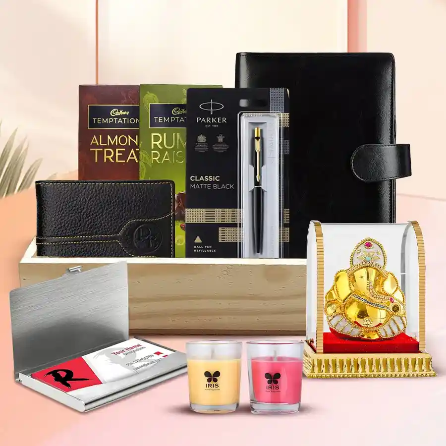 Exquisite Diwali Hamper with Vignesh Ganesh Idol, including Cadbury Temptation bars, stylish planner and Parker pen, black leather wallet, visiting card holder, Iris candles, wooden tray, and festive Diwali card.
