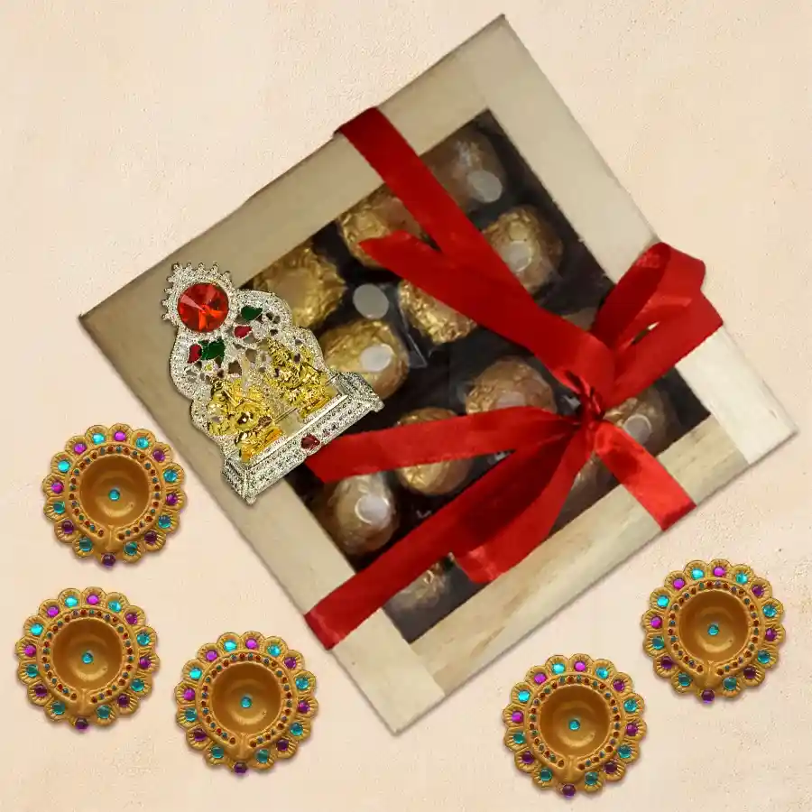 Remarkable Diwali hamper featuring 16 Ferrero Rocher chocolates, an antique-inspired Lakshmi Ganesh mandap, and six beautifully designed diyas in a charming wooden box.