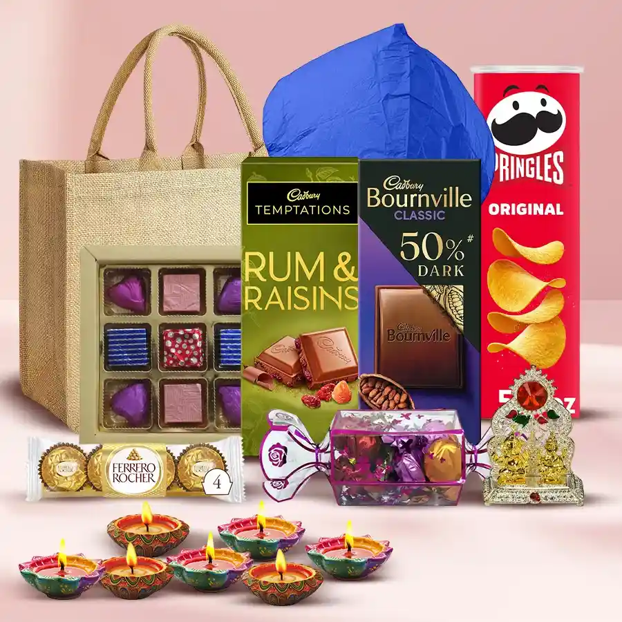 Remarkable Diwali Hamper featuring Pringle Chips, Cadbury chocolates, homemade toffees, Ferrero Rocher, Ganesh Laxmi Mandap, designer diyas, flying lantern, and eco-friendly jute bag.