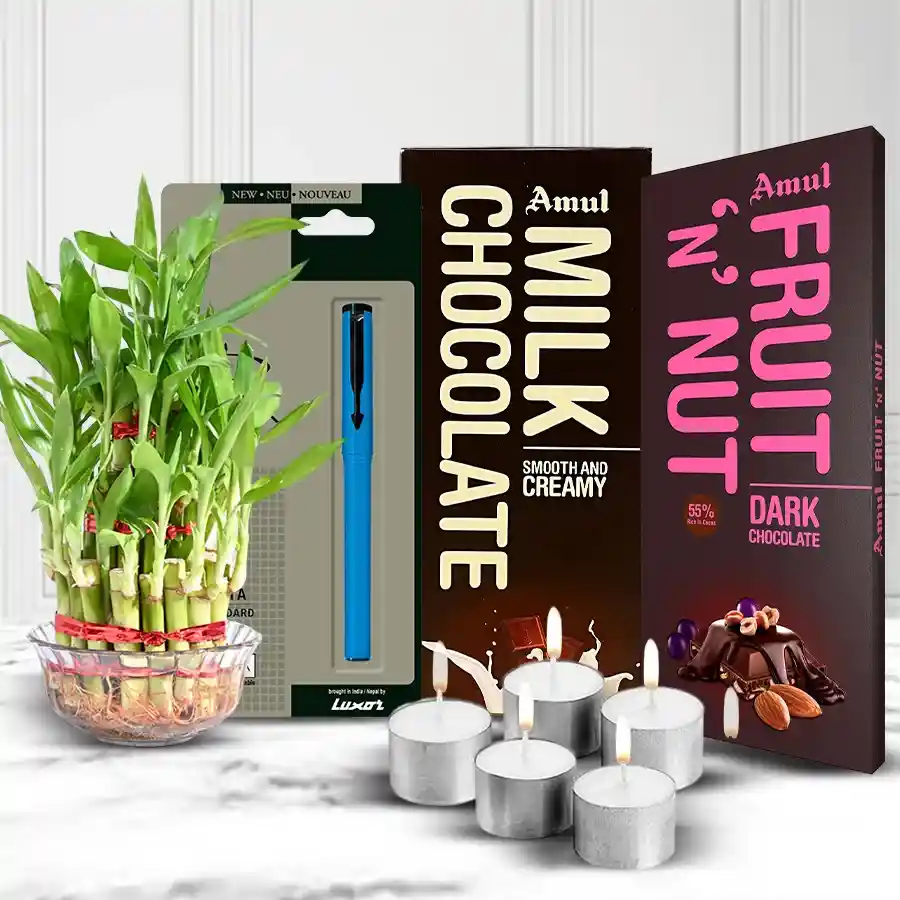 Eco-friendly Diwali gift hamper featuring Amul chocolates, a Parker Beta Pen, a 3-tier Lucky Bamboo Plant, and five tea light candles.