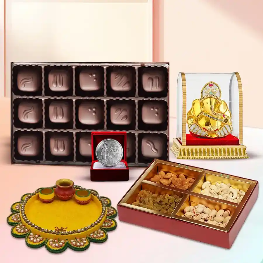 Exclusive Diwali gift hamper featuring handcrafted chocolates, premium dry fruits, a decorated Vighnesh Ganesh idol, a designer pooja thali, and a silver-plated Ganesh Lakshmi coin.