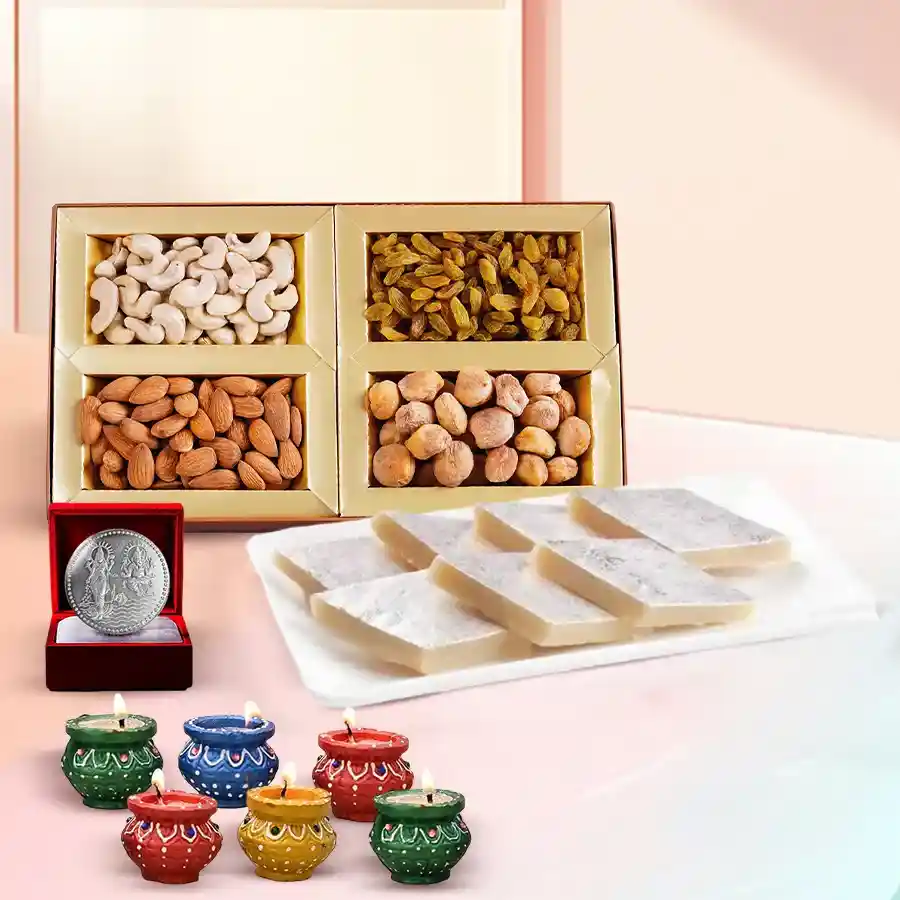 Tasty Kaju Katli and dry fruits gift hamper for Diwali featuring Bhikharam Kaju Katli, assorted dry fruits, mud diyas, and a silver-plated Ganesh-Laxmi coin