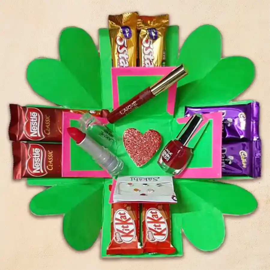 2 Tier Lakme Cosmetics and Chocolates Explosion Box featuring maroon nail polish, lipstick, sindoor, designer bindis, and assorted chocolates