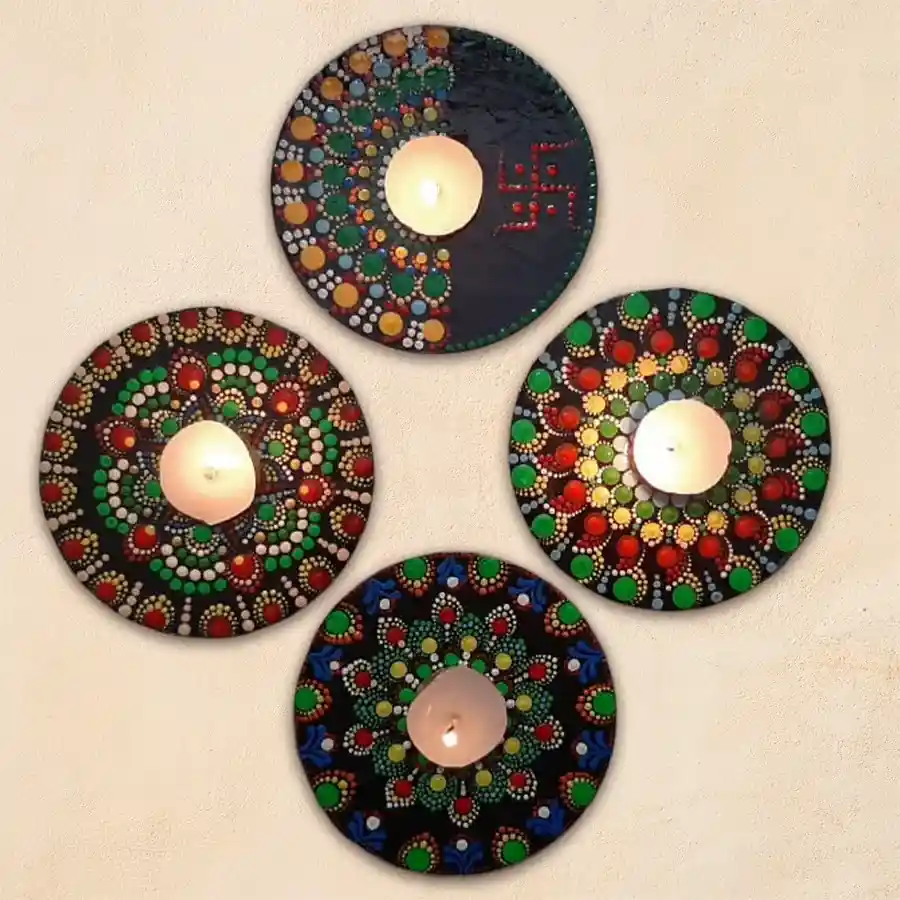 Exclusive Diwali Decor set featuring 4-piece Dot Mandala Art handmade Swastik Rangoli and tea light candles, beautifully arranged for festive celebrations.