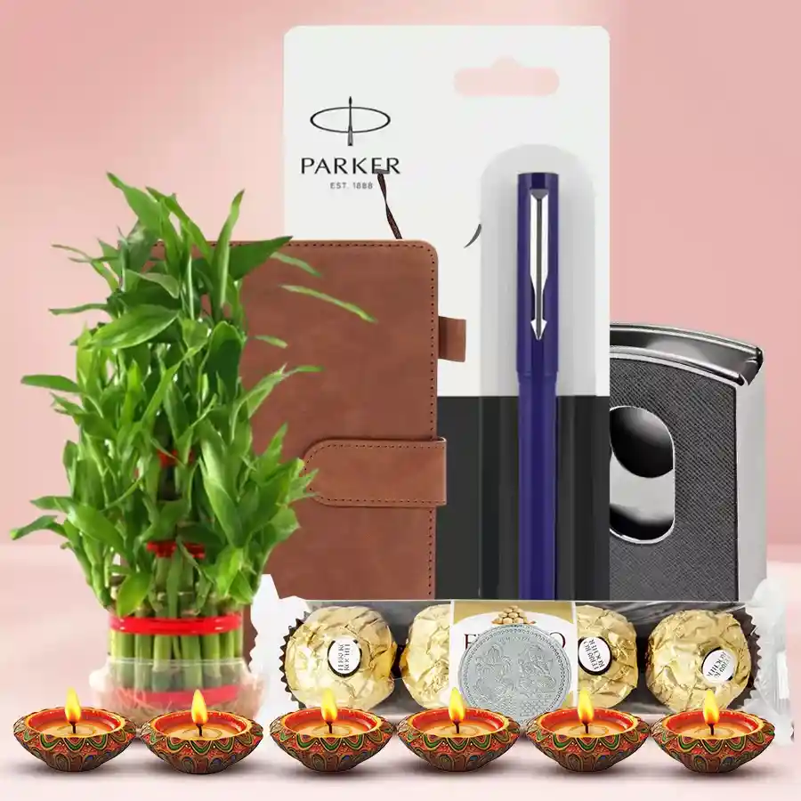 Marvelous Environment Friendly Gift Hamper for Diwali featuring a planner diary, Parker Beta pen, card holder, Ferrero Rocher chocolates, lucky bamboo plant, mud diyas, and a silver-plated Ganesh-Laxmi coin.